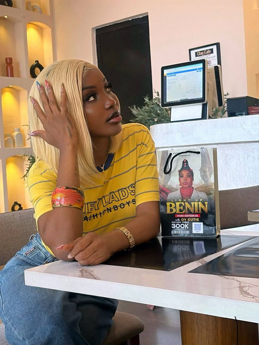 OY Kutie beside the Light Up Benin Golden Table bag